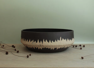 Black bowl with white stripe