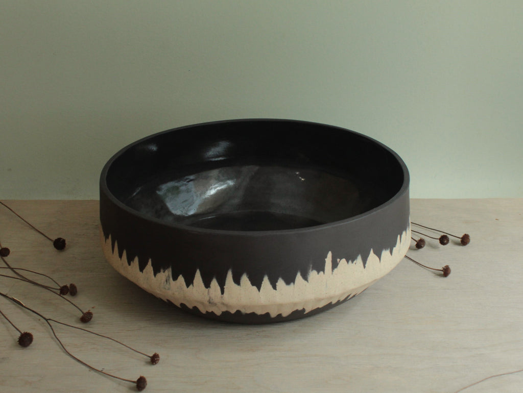 Black bowl with white stripe