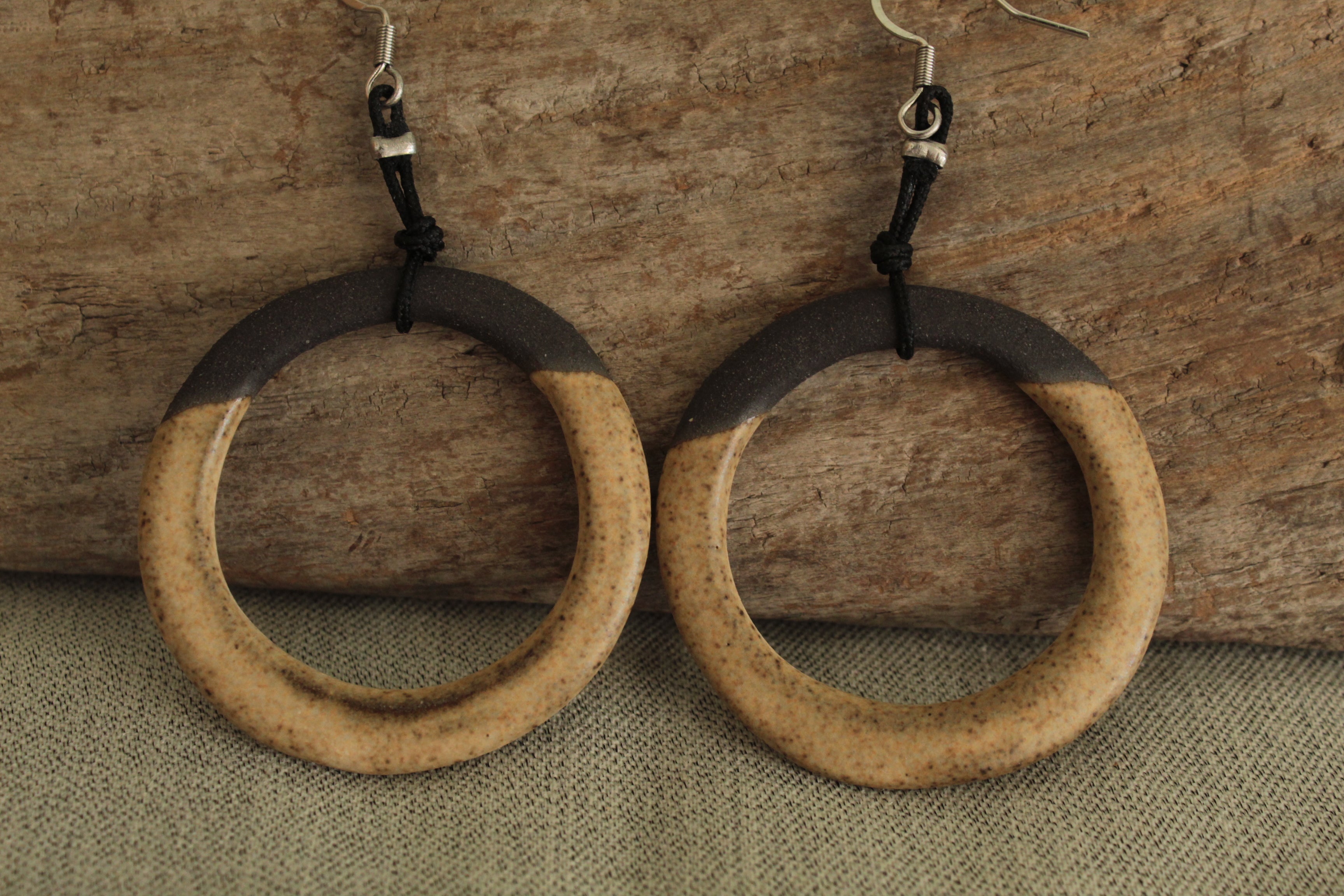 Black and light brown hoop dangling earrings with cord