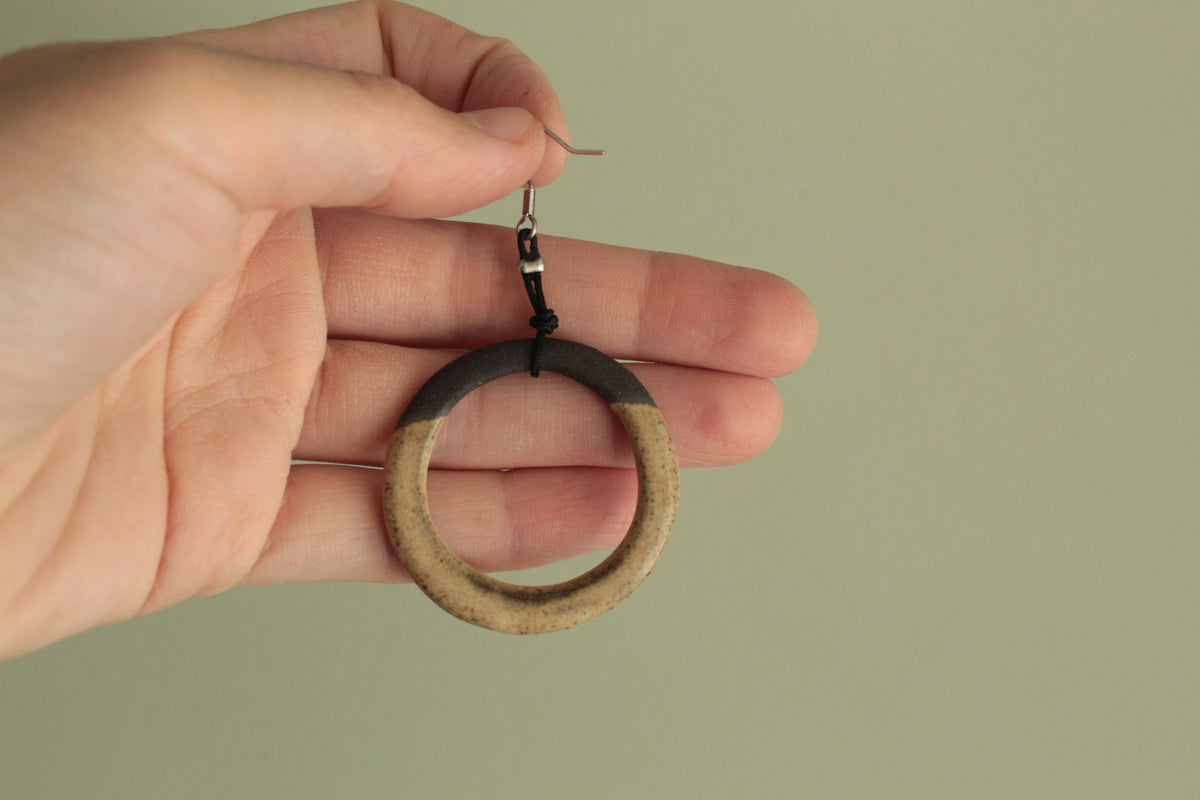 Black and light brown hoop dangling earrings with cord
