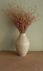 White vase with black rocks - 2