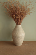 White vase with black rocks - 2