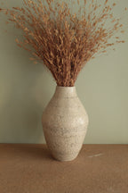 White vase with black rocks - 2