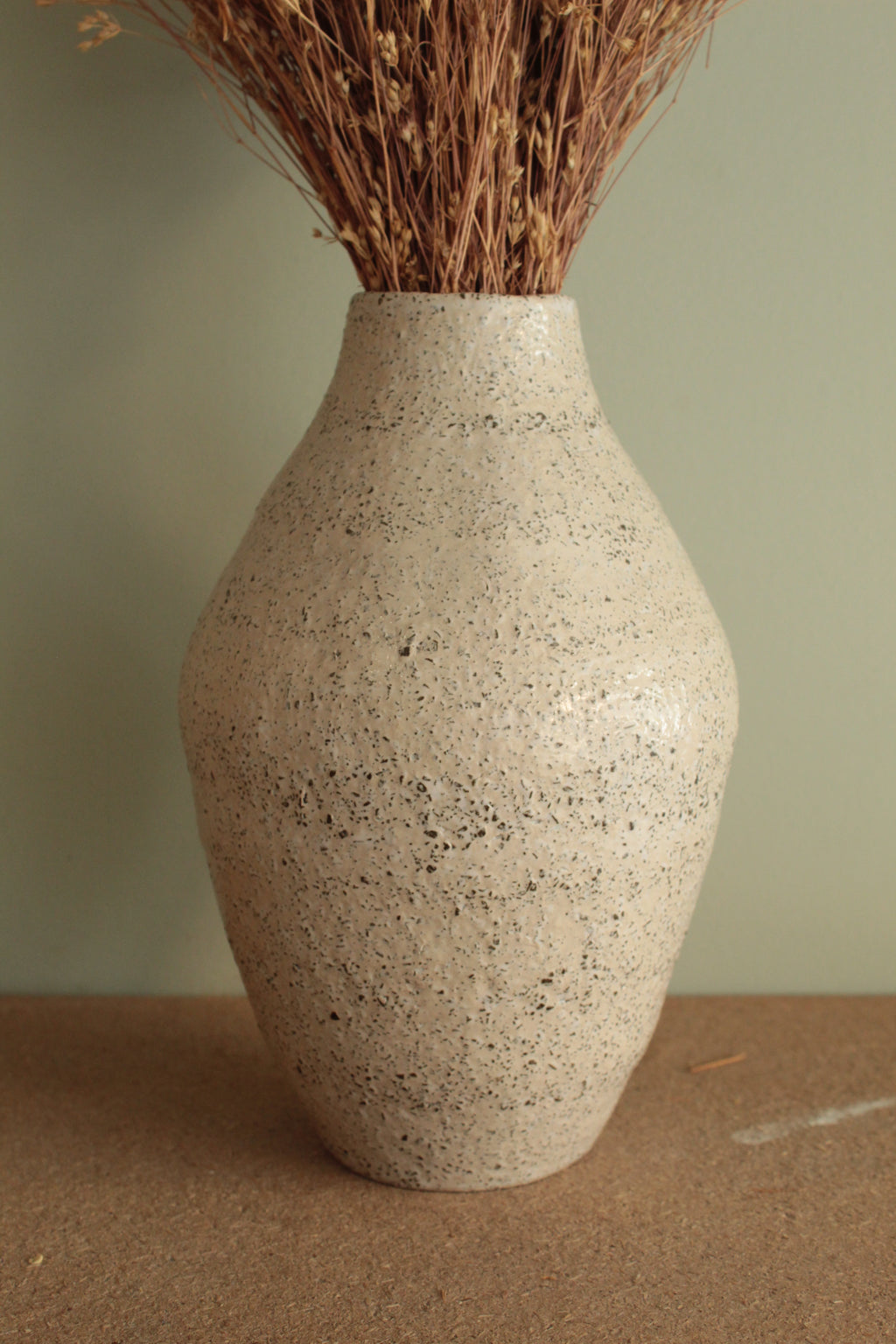 White vase with black rocks - 2