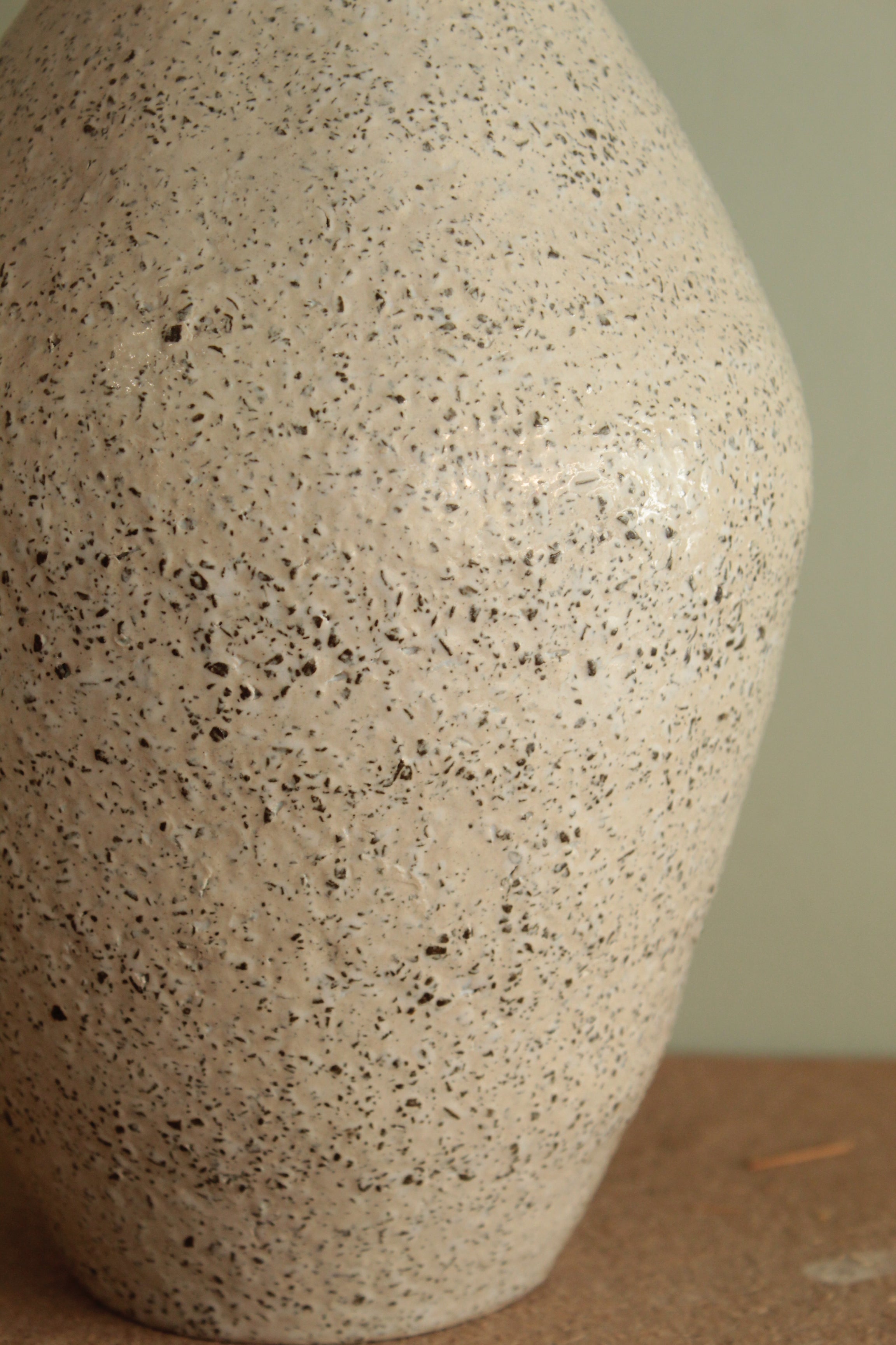 White vase with black rocks - 2