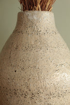 White vase with black rocks - 2