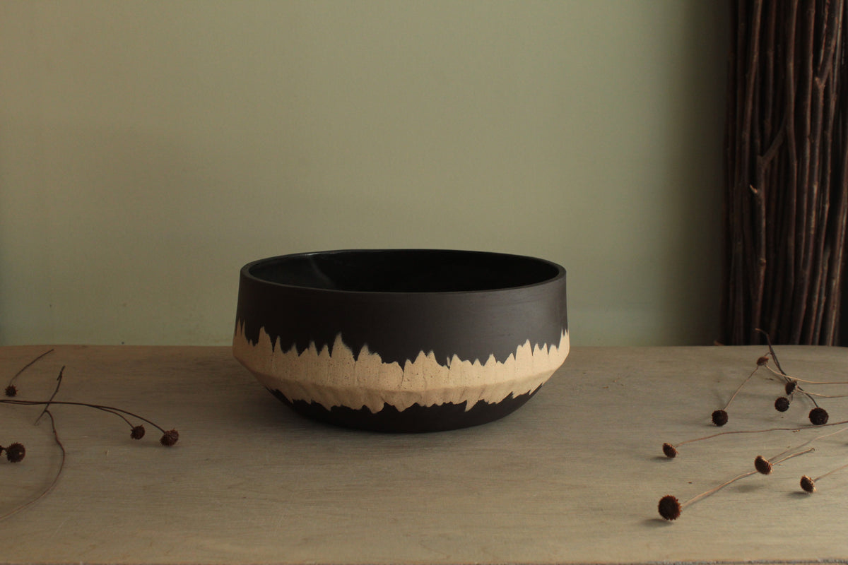 Black bowl with white stripe