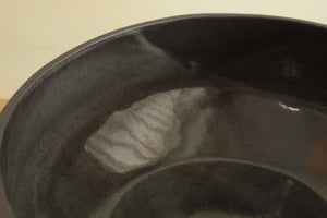 Black bowl with white stripe