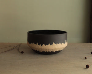 Black bowl with white stripe