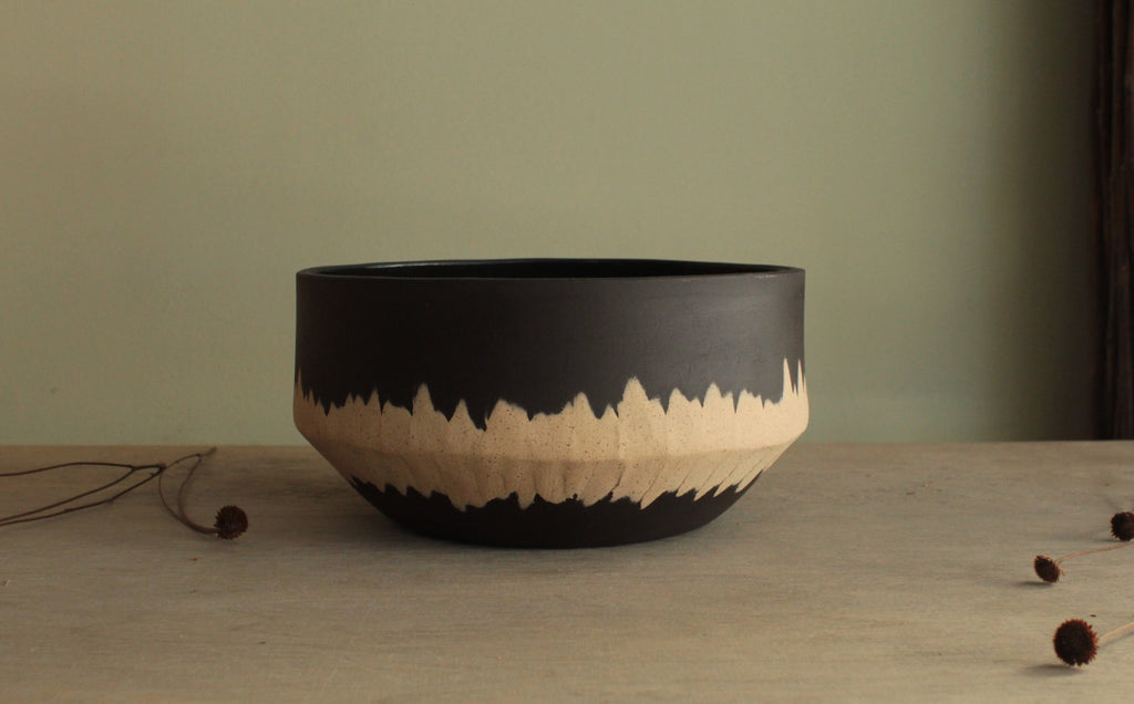 Black bowl with white stripe