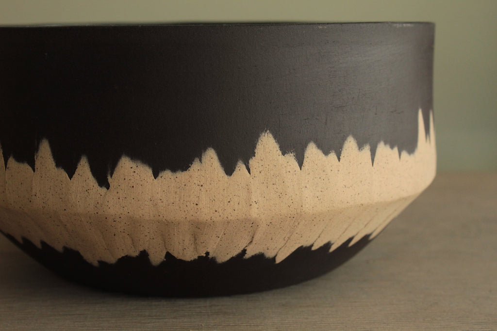 Black bowl with white stripe