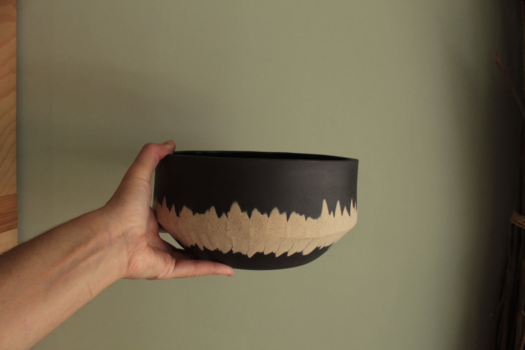 Black bowl with white stripe