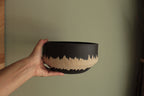Black bowl with white stripe