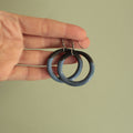 Black and blue hoop dangling earrings