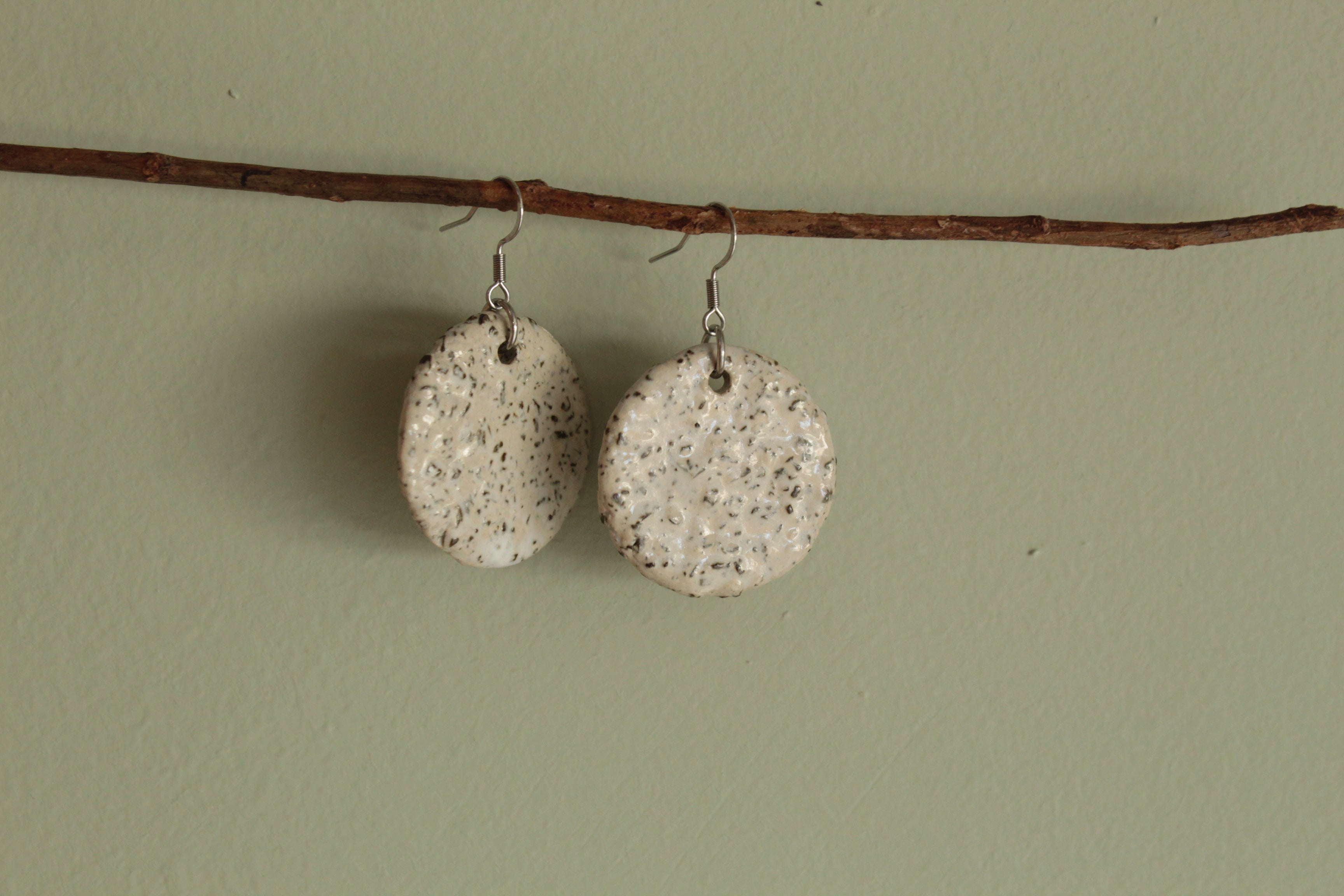 White circle with rocks dangling earrings