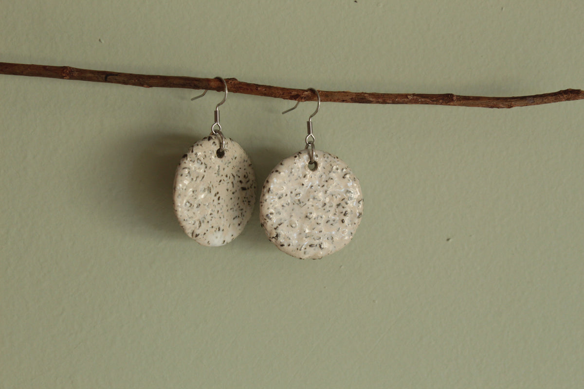 White circle with rocks dangling earrings