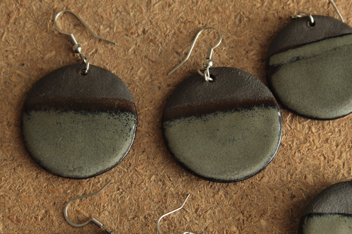 Black and dark sage circle dangling earrings