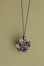 White with dark blue design circle necklace
