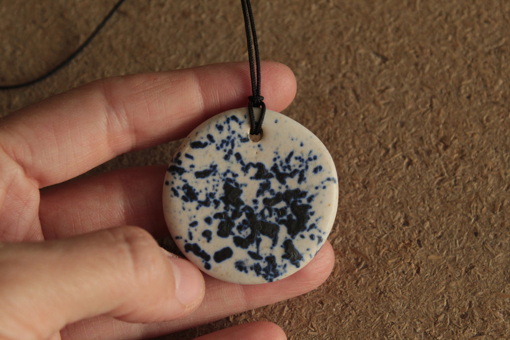 White with dark blue design circle necklace