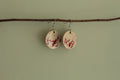 Beige with red design circle dangling earrings
