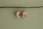 Beige with red design circle dangling earrings
