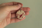 Beige with red design circle dangling earrings