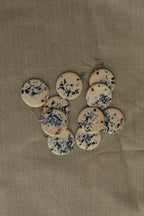 White with blue design circle dangling earrings