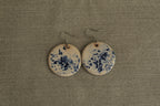 White with blue design circle dangling earrings