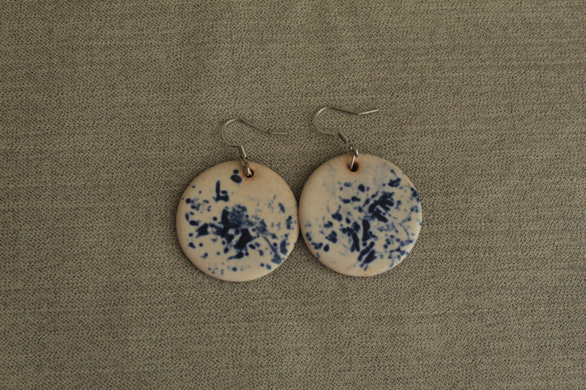 White with blue design circle dangling earrings