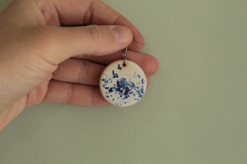 White with blue design circle dangling earrings