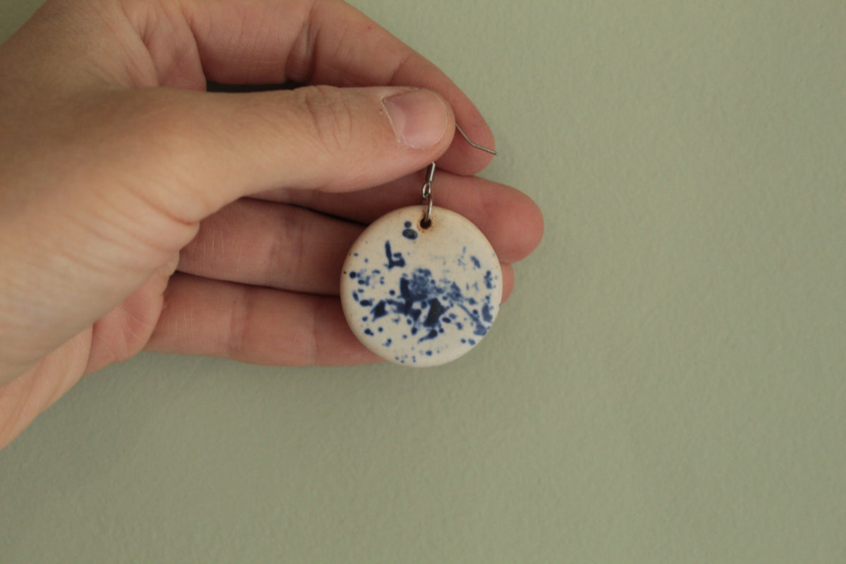 White with blue design circle dangling earrings