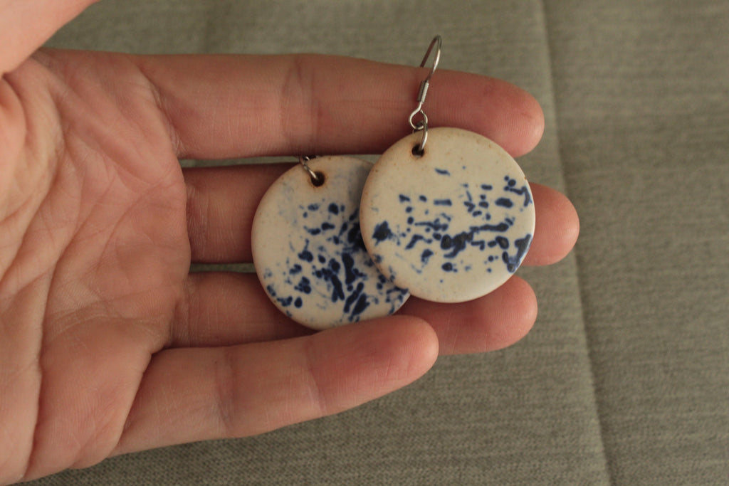 White with blue design circle dangling earrings