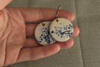 White with blue design circle dangling earrings