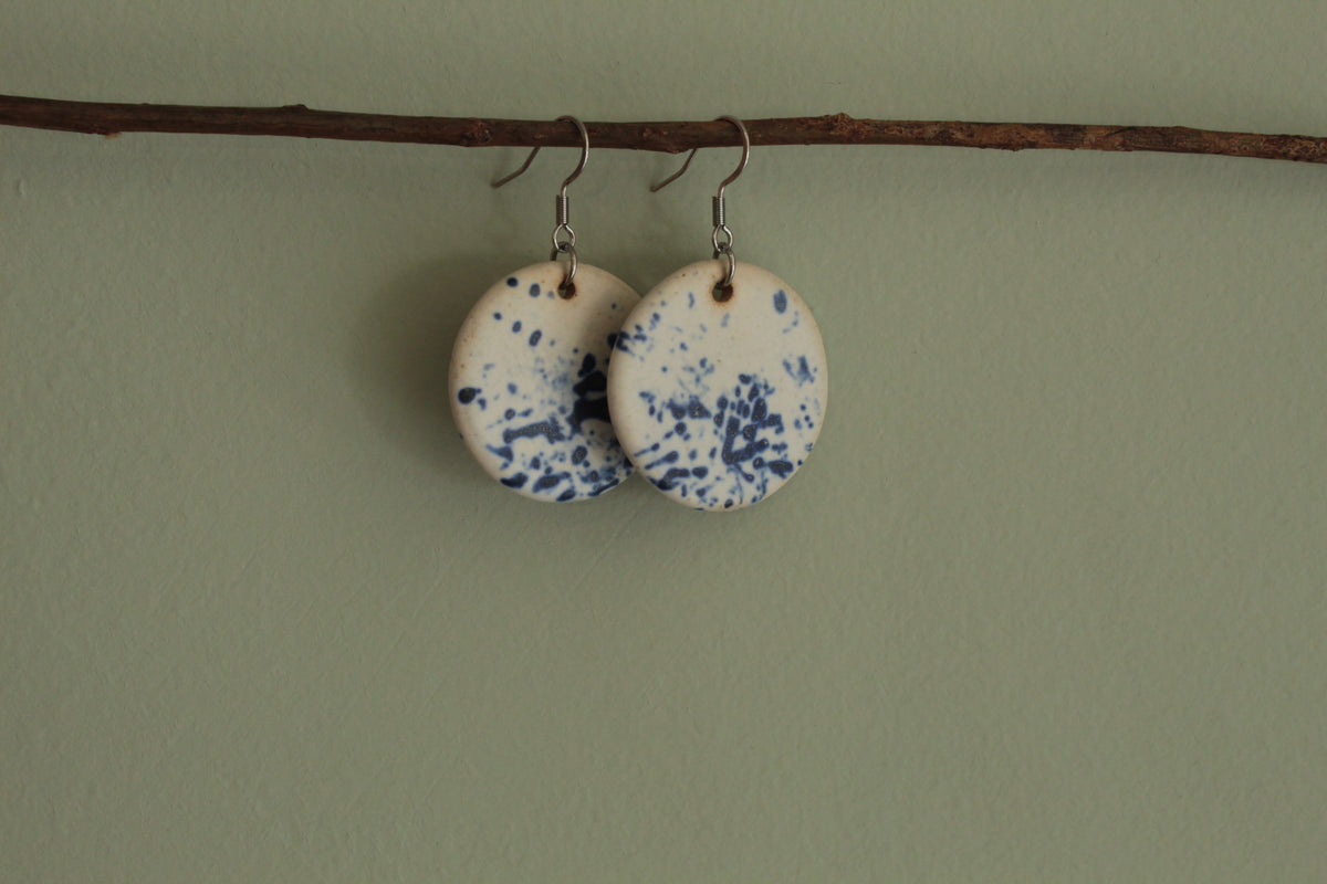 White with blue design circle dangling earrings
