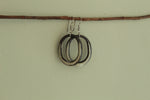 Load image into Gallery viewer, Black and beige oval hoop dangling earrings
