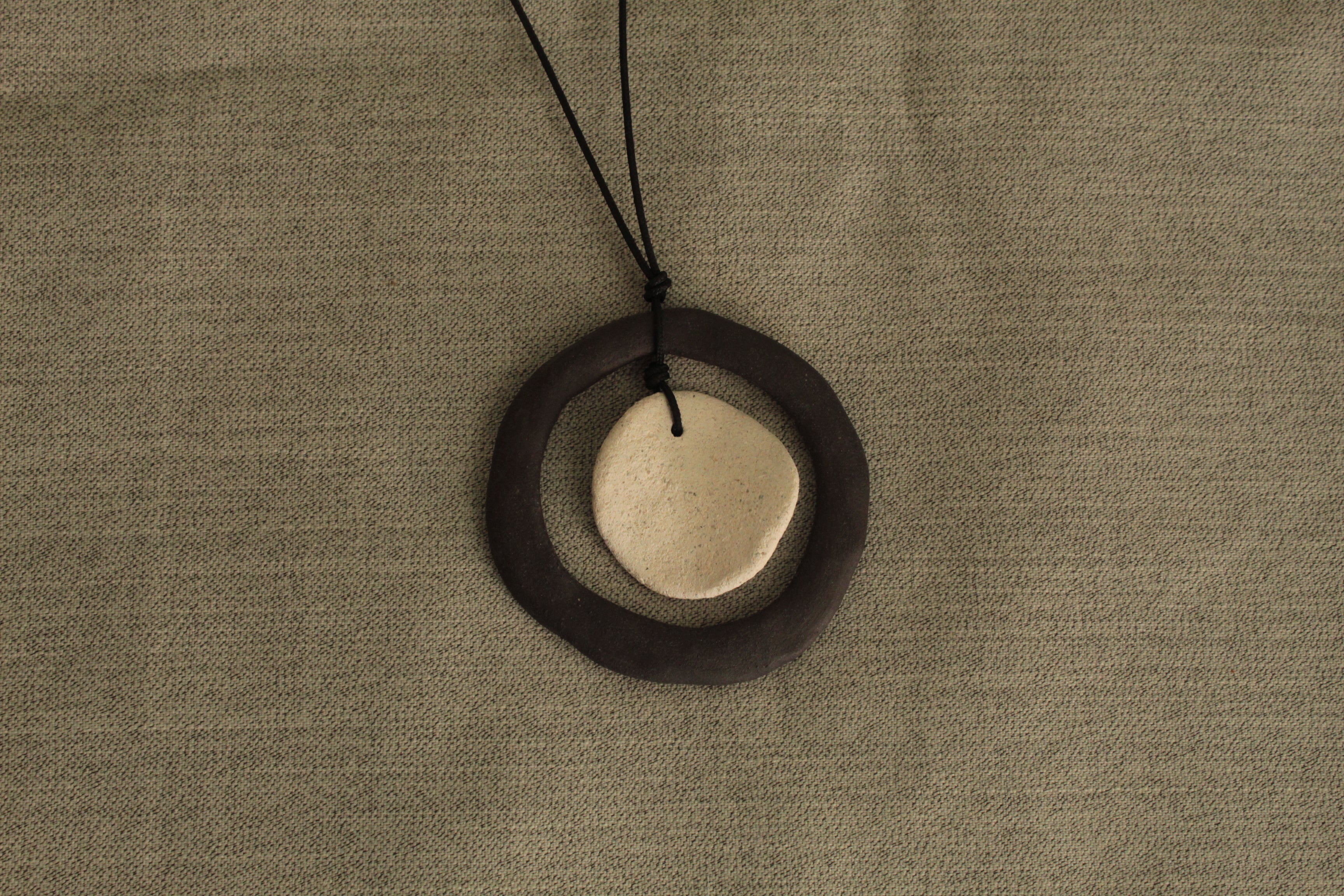 Black hoop and white circle necklace