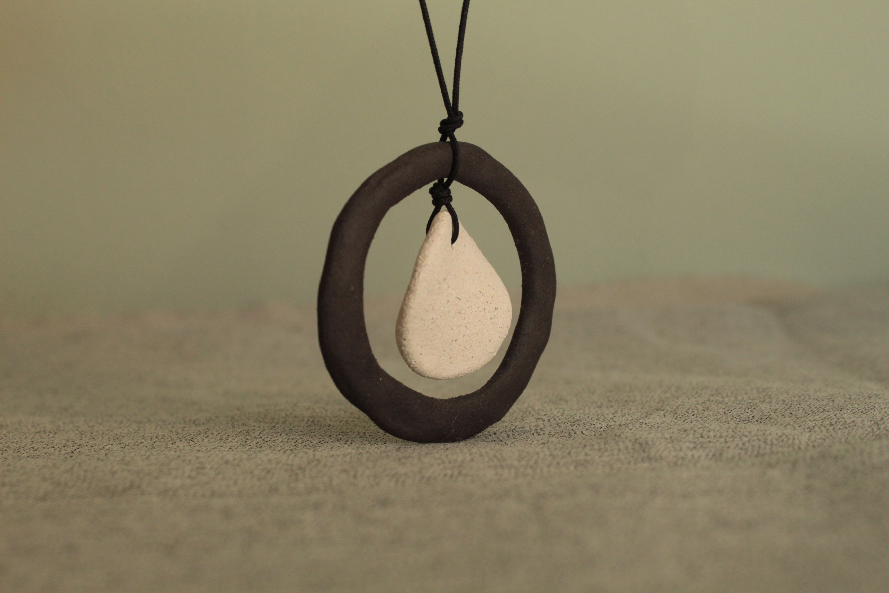 Black hoop and white circle necklace