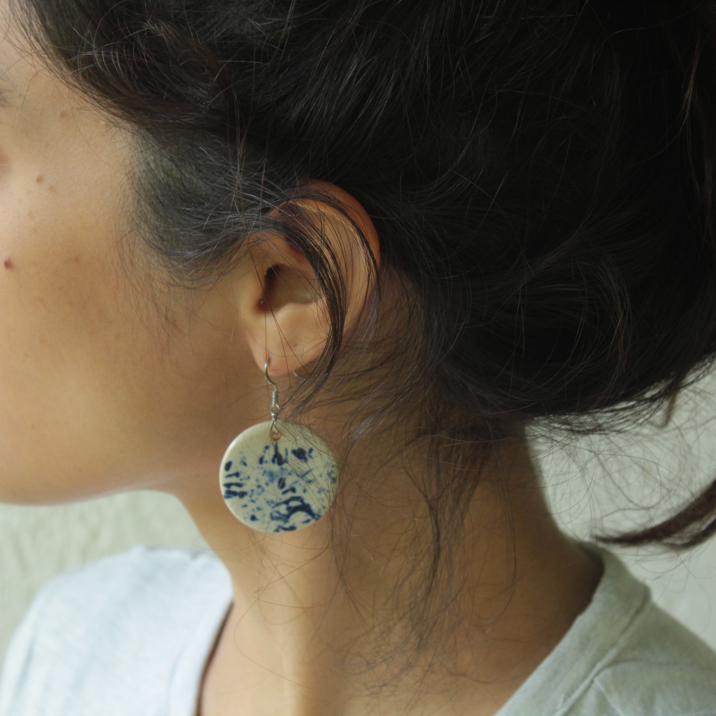 White with blue design circle dangling earrings