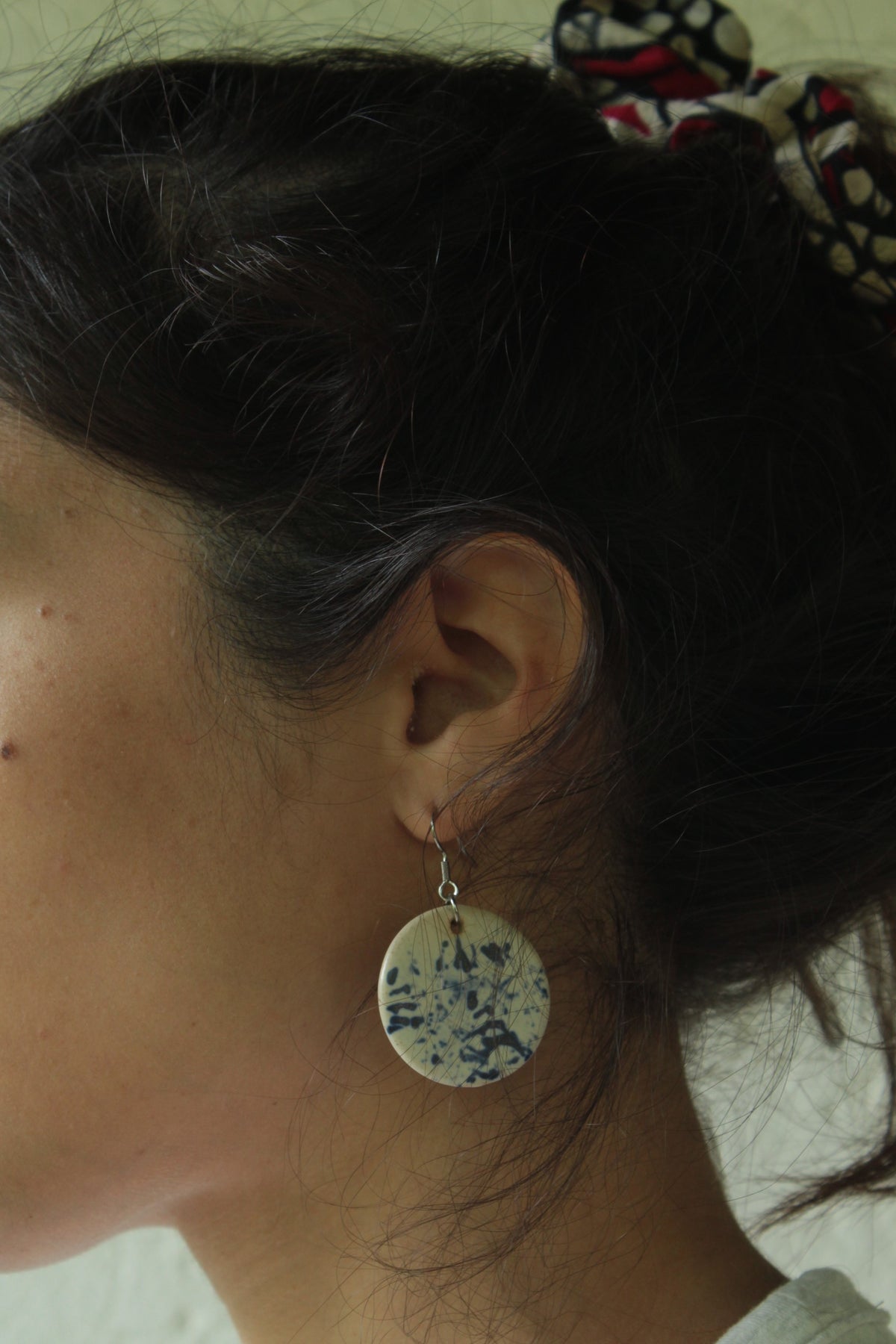 White with blue design circle dangling earrings