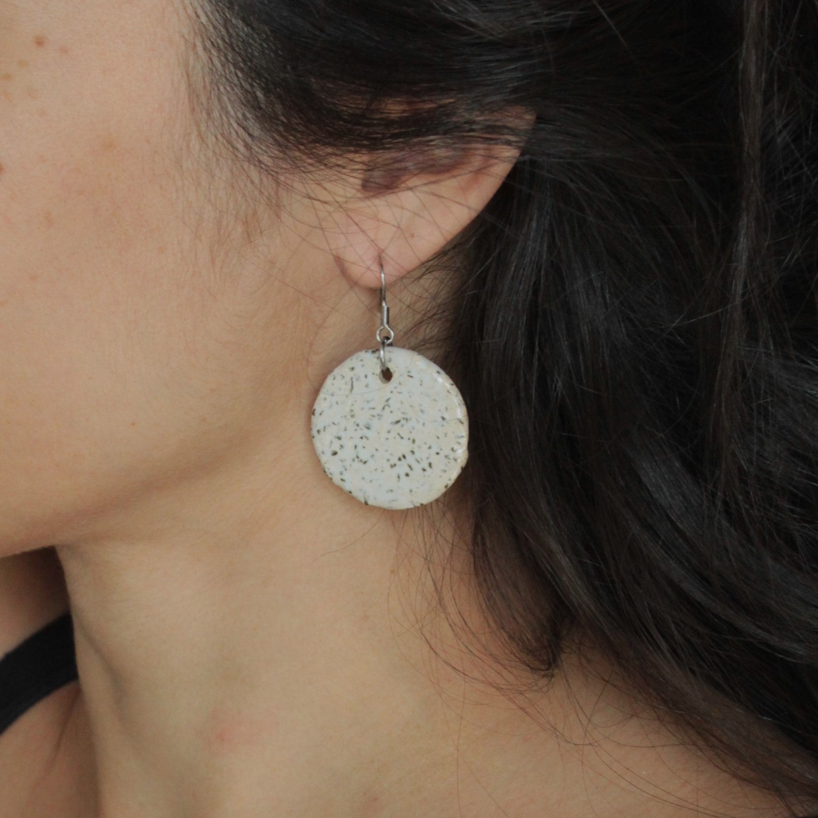 White circle with rocks dangling earrings