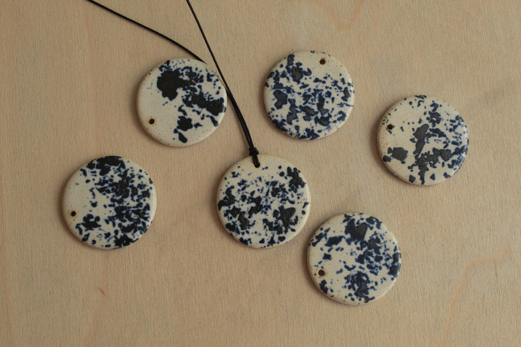 White with dark blue design circle necklace