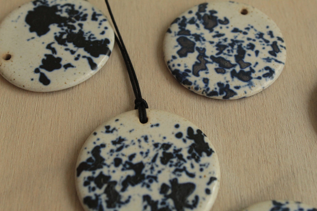 White with dark blue design circle necklace