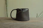 Dark sage mug with texture and drippings