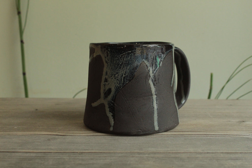Dark sage mug with texture and drippings
