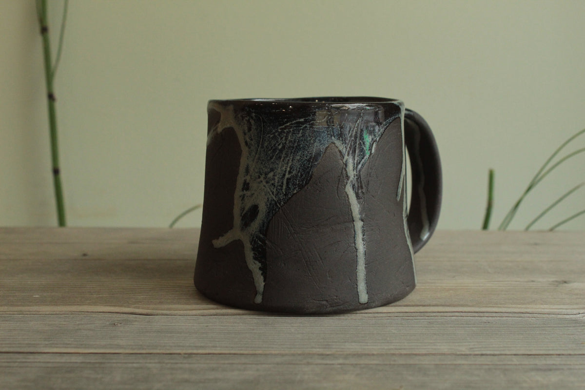 Dark sage mug with texture and drippings