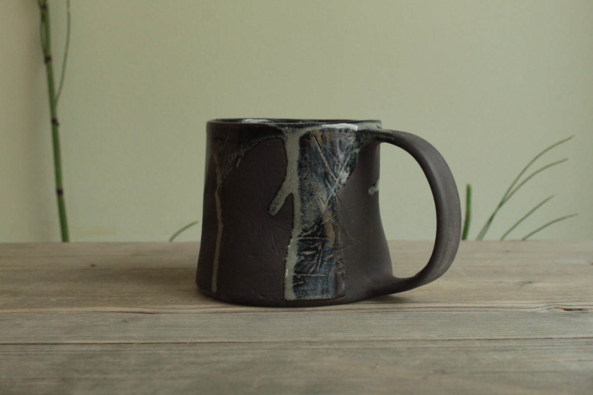 Dark sage mug with texture and drippings