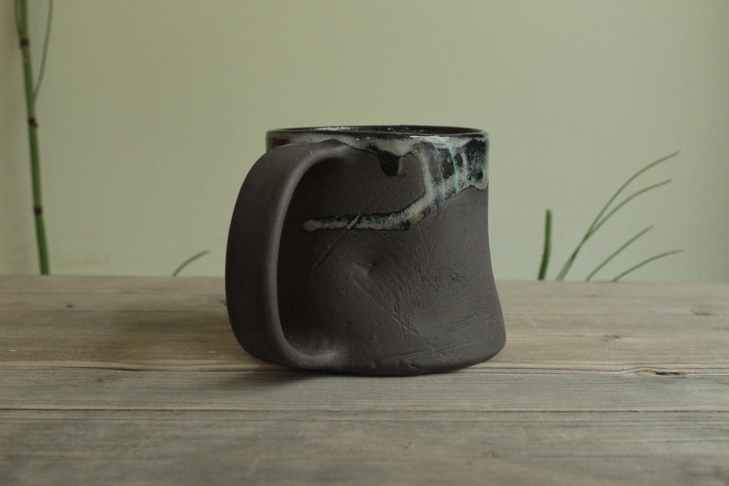 Dark sage mug with texture and drippings