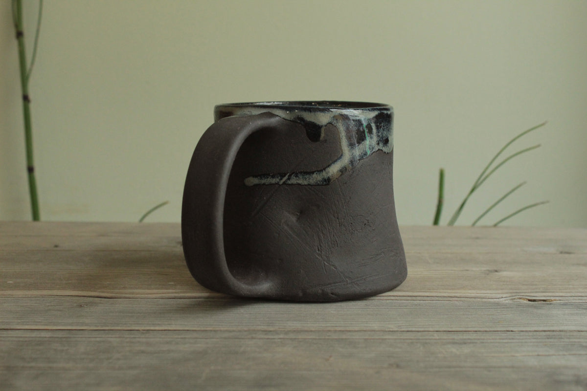 Dark sage mug with texture and drippings