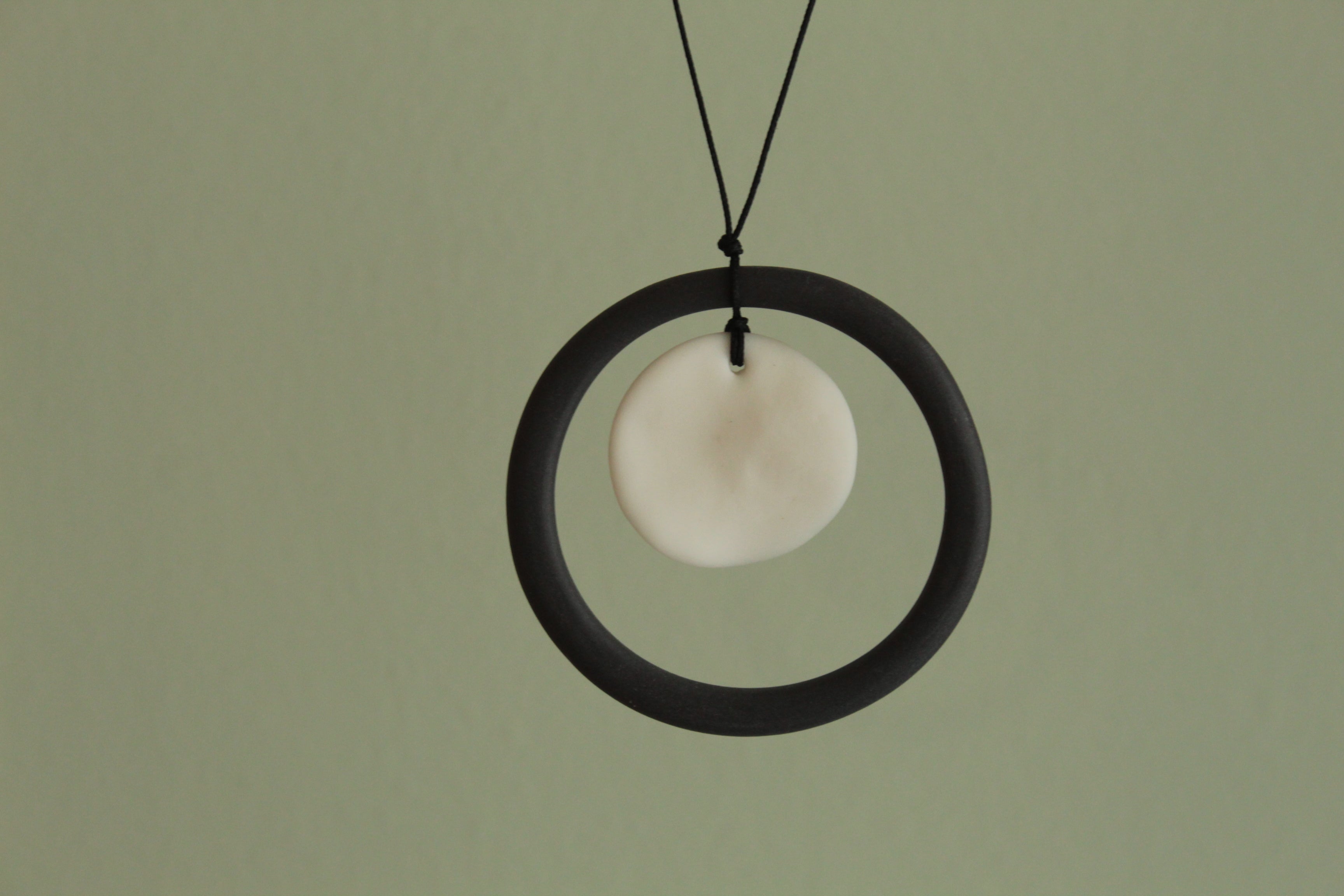 Black hoop and white circle porcelain necklace