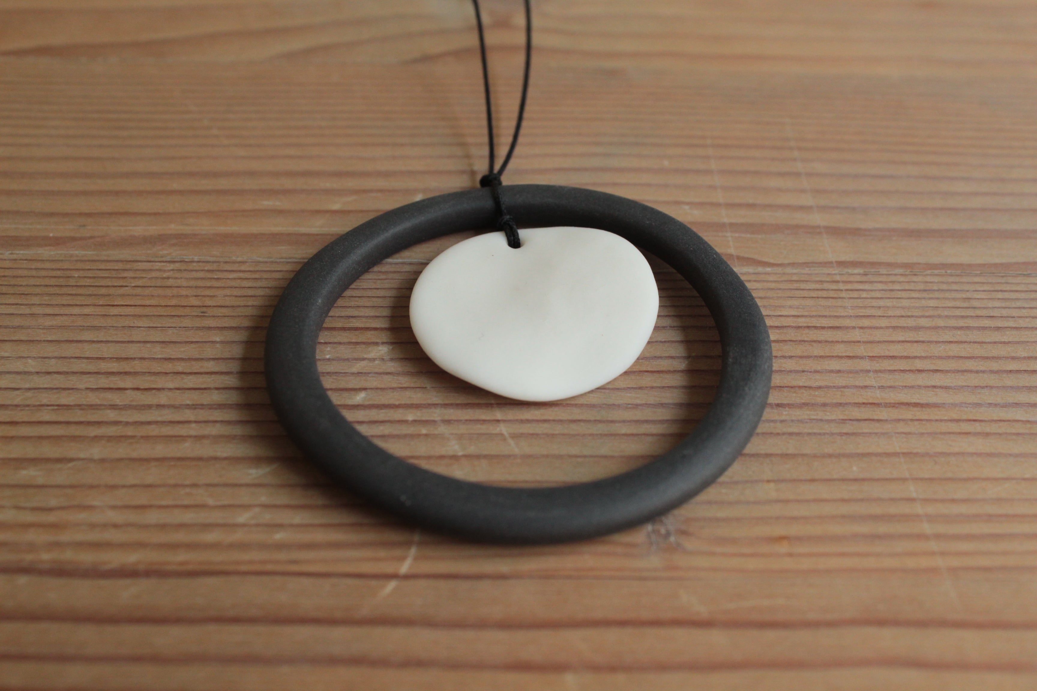 Black hoop and white circle porcelain necklace